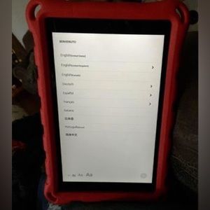 Amazon Kindle Fire 10 with red hard case, screen protector, and charger.